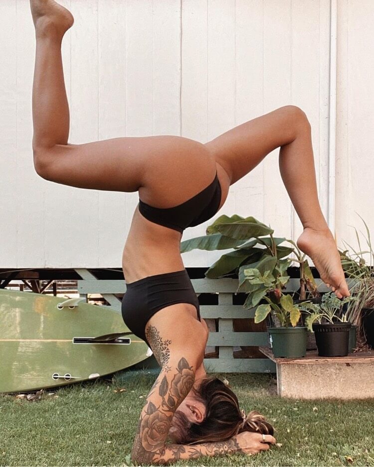 Jenah Yamamoto doing a yoga pose, looking lean and fit.
